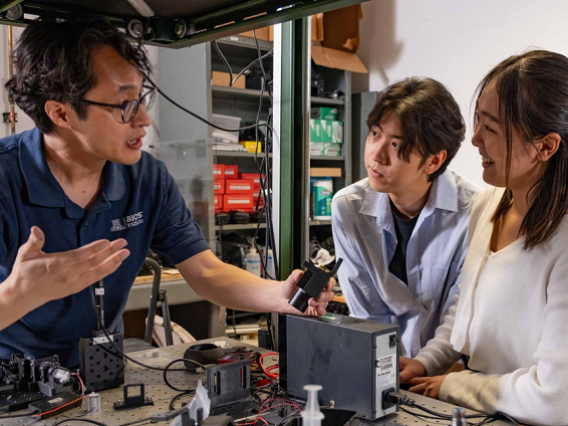 BME associate professor DongKyun Kang meets with his students