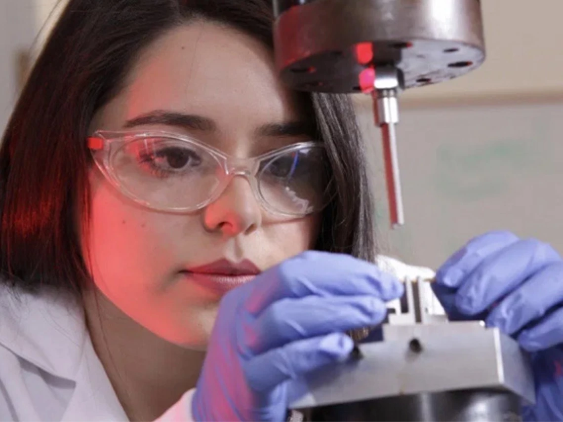 student working on biomedical equipment