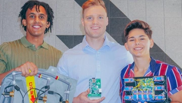 Ian Jackson, center, with Simon Tecle at left and Kirsten Bassett, pose with components of their company's proprietary system.