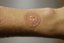 Microfluidic sensor on wet skin