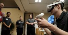 A University of Arizona student wears a virtual reality headset
