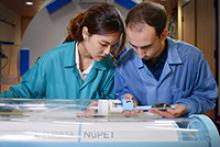 Two Cubresa researchers insert a mouse into the NuPET system on July 28. The UA was chosen as the first U.S. institution to receive the technology; image courtesy of Cubresa Inc.