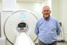 Primary investigator Ted Trouard with the university's current Siemens 3T Skyra MRI. 