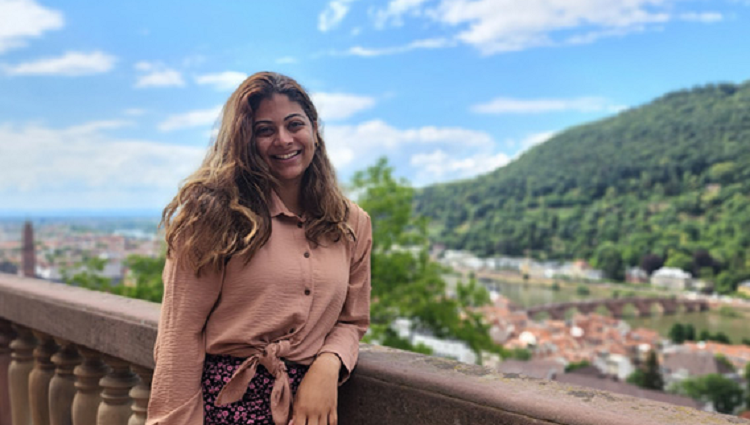 Biomedical engineering student Hasina Shir stands on a bridge in Germany