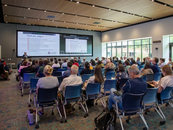 People in a large auditorium.
