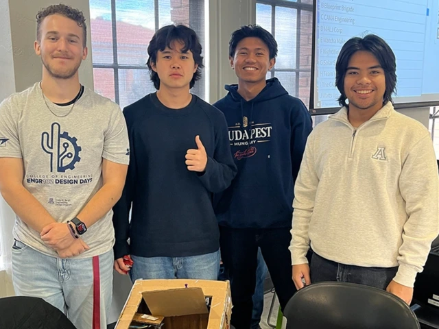 (From left) Engineering undergraduates Nick Inscho and Joshua Fraire collaborate with electrical engineering major Henrich Buendia and civil engineering major Baw Reh to design a sensor-equipped garbage can that alerts users when full.
