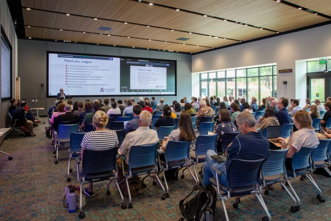 People in a large auditorium.
