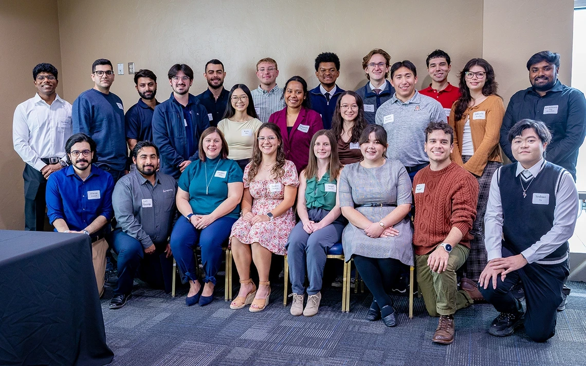 A bunch of people take a photo.