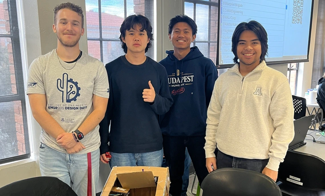 (From left) Engineering undergraduates Nick Inscho and Joshua Fraire collaborate with electrical engineering major Henrich Buendia and civil engineering major Baw Reh to design a sensor-equipped garbage can that alerts users when full.